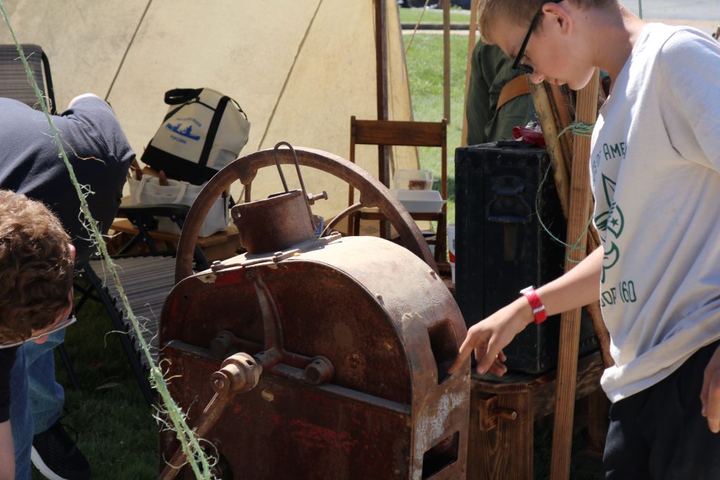 Corn Shelling Image 1: next to the woodcarvers, we had an old fashioned corn sheller.