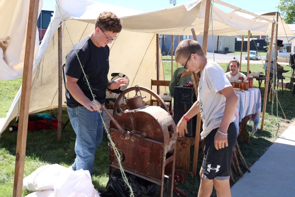 Corn Shelling Image 2: We have some volunteers testing out the corn sheller.