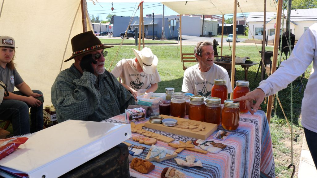 Woodcarving and Honey Exhibit Image 1: walking over from the blacksmith, we have woodcarvers who are also knowledgeable in beekeeping and the process of making honey.